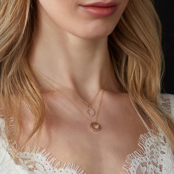 model wearing cz set open circle pendant in gold