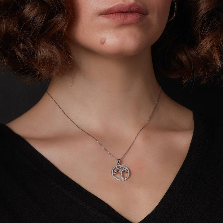 silver tree of life necklace on a model