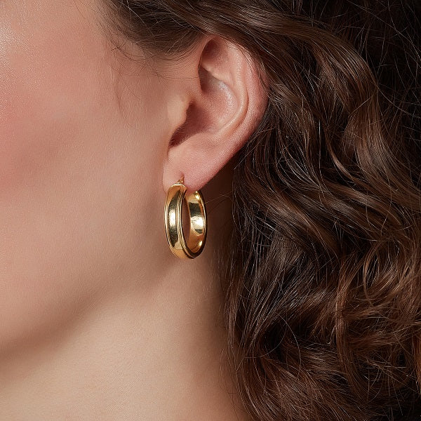 wedding band hoop earrings on a model