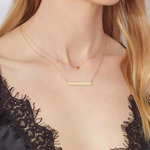yellow gold circle disc necklace on a model